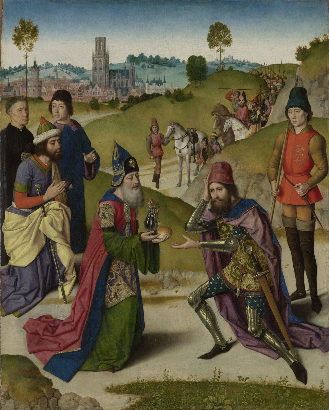 A mitred, white-bearded priest in a green and gold brocade robe holds a glass flask of wine and a round loaf toward a kneeling knight in full armor, with a town and its tall church tower in the distance and a line of soldiers on the hill at right.
