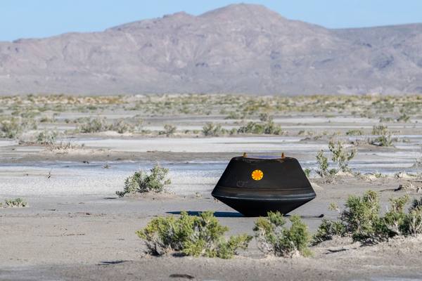 The sample return capsule from NASA's OSIRIS-REx mission, carrying material collected from the asteroid Bennu in October 2020, rests in the desert at the Department of Defense's Utah Test and Training Range shortly after touching down on September 24, 2023.